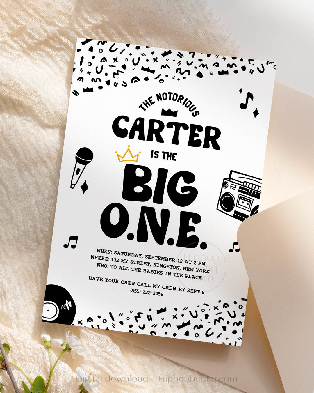 Hip-hop themed, printed birthday invitation card. The card features an editable 'The Big One' design including a customizable child's name. The card also features a black and white squiggly pattern, 90s rap-themed illustrations, and a golden crown.