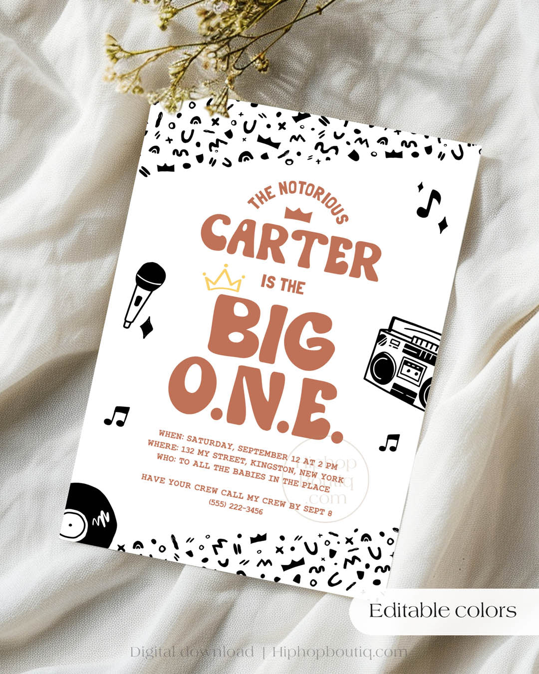 Hip-hop themed, printed birthday invitation card. The card features an editable 'The Big One' design including a customizable child's name. The card also features a black and white squiggly pattern, 90s rap-themed illustrations, and a golden crown. Text reads: Editable colors.