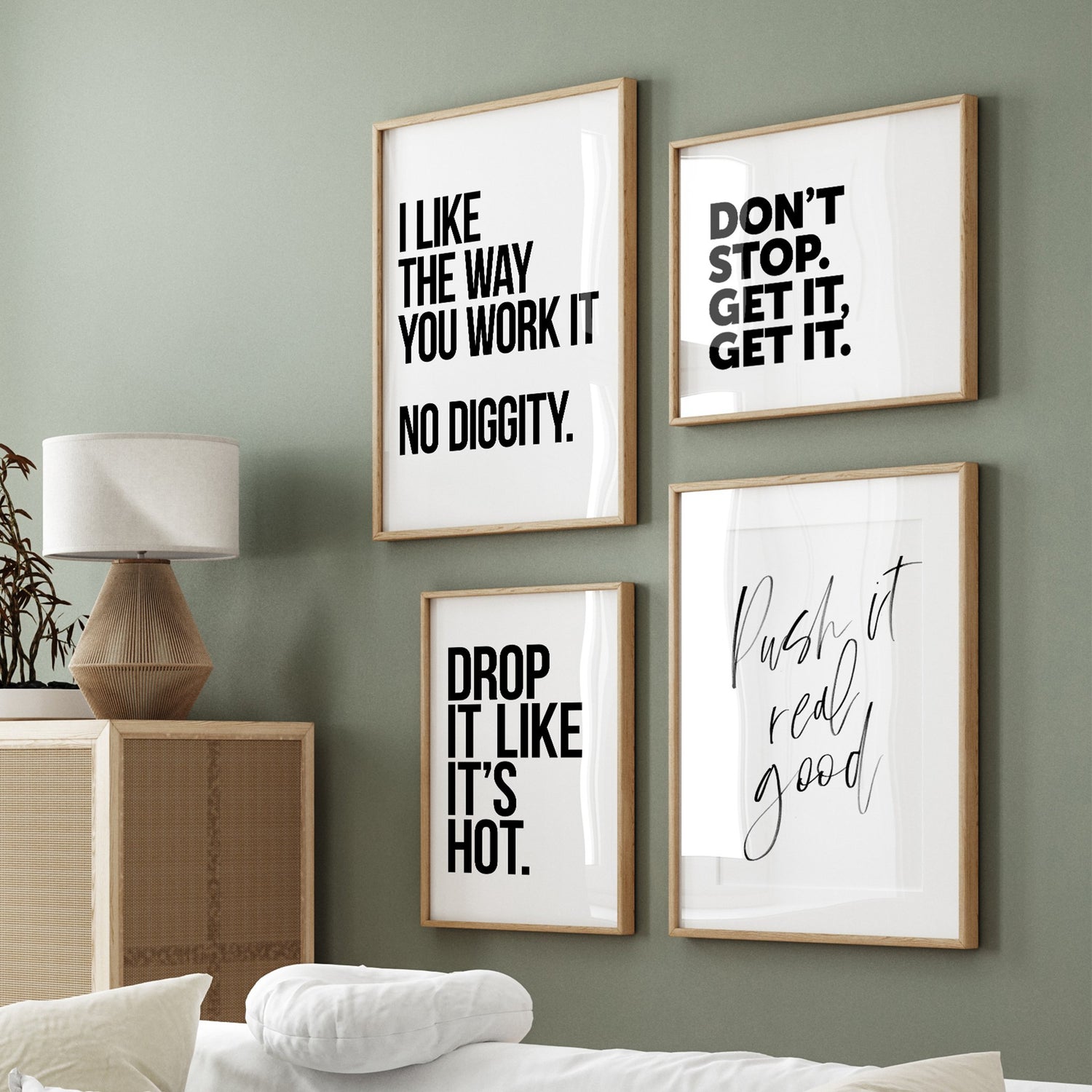 Hip hop-themed typographic posters hanging on a green living room wall