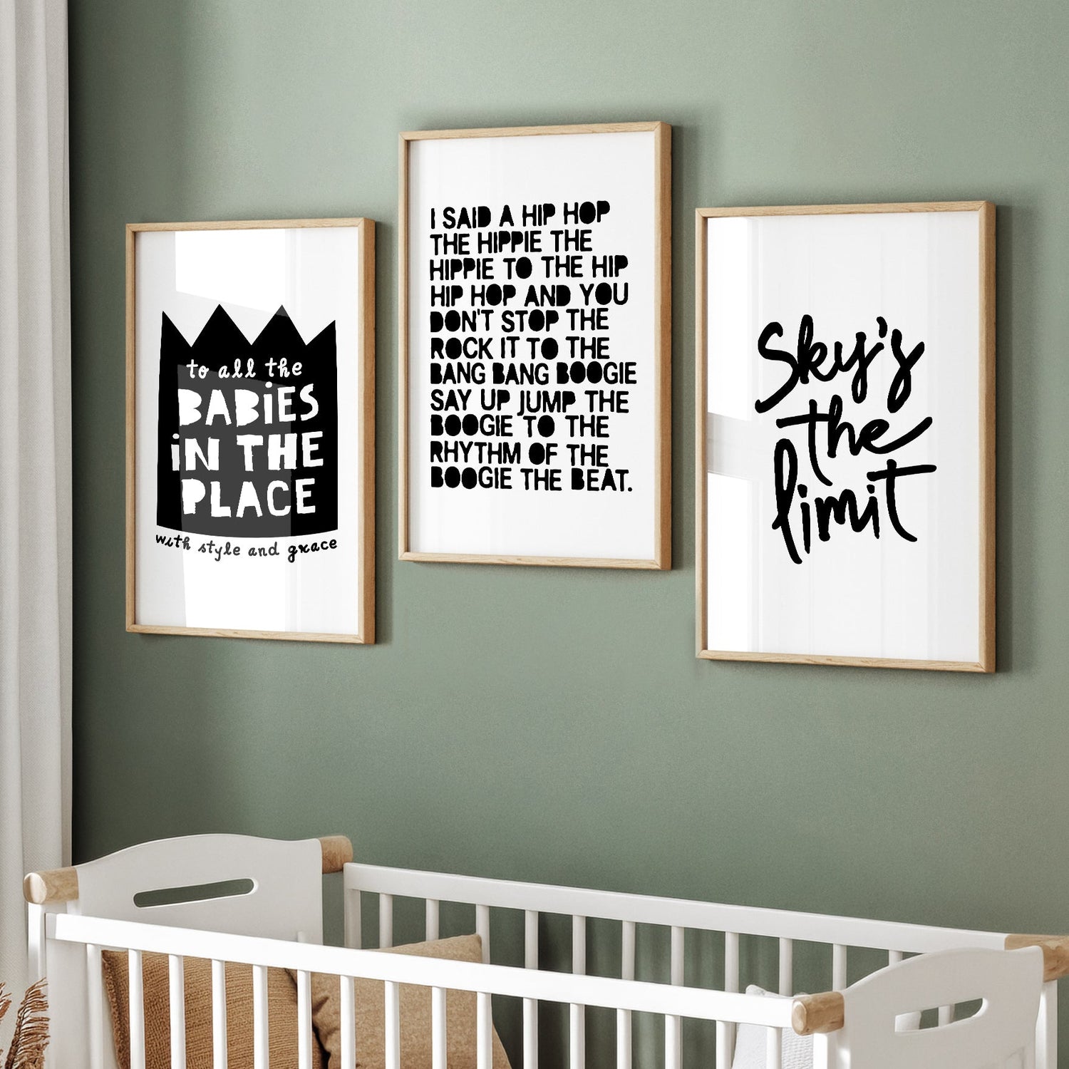White frame with a hip hop-themed typographic poster resting on a piece of textile